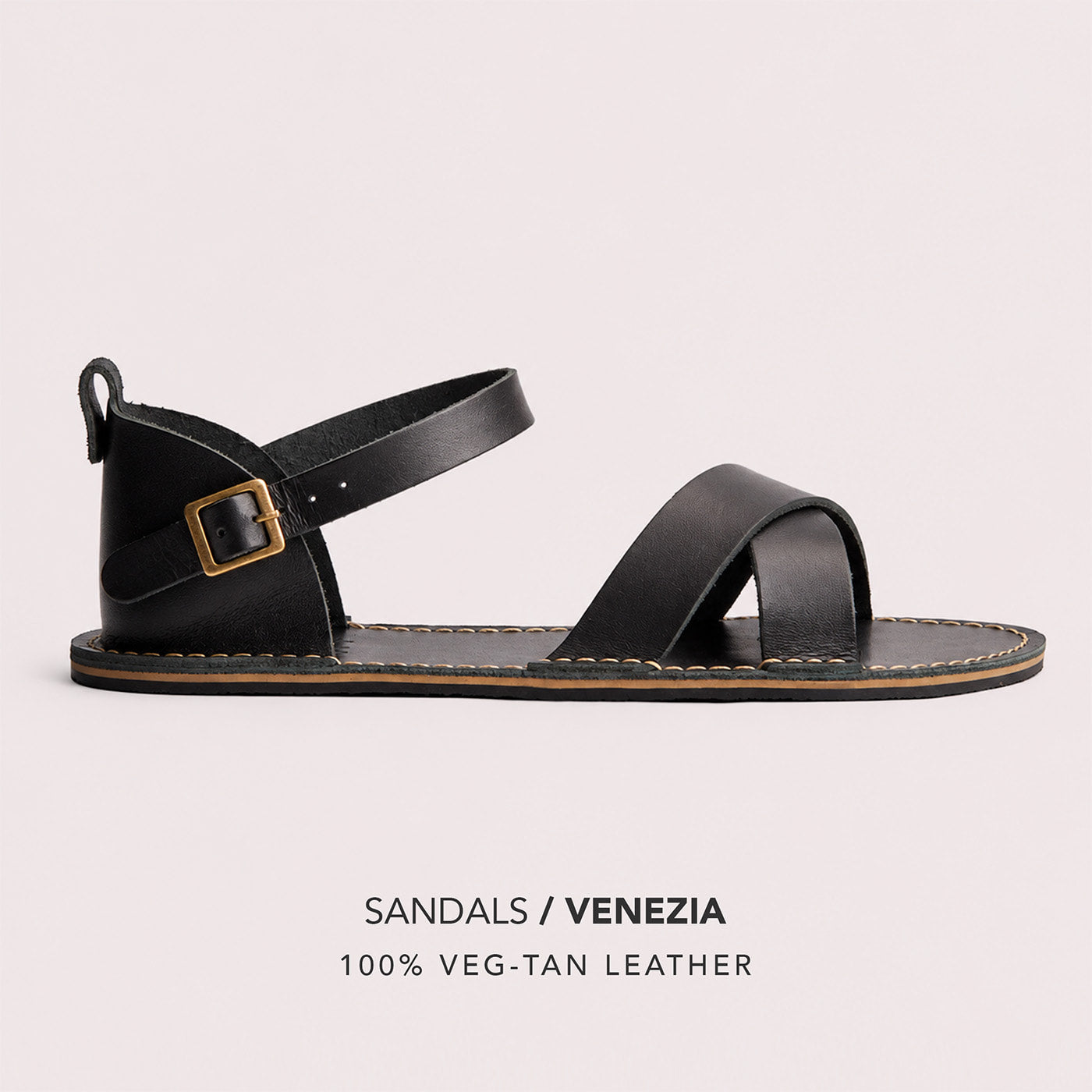 Nero | Flat leather sandals with ankle straps and debossed PLG three tree logo in soles, shown on a light gray background with text below reading 'SANDALS / VENEZIA' and '100% VEG-TAN LEATHER'.