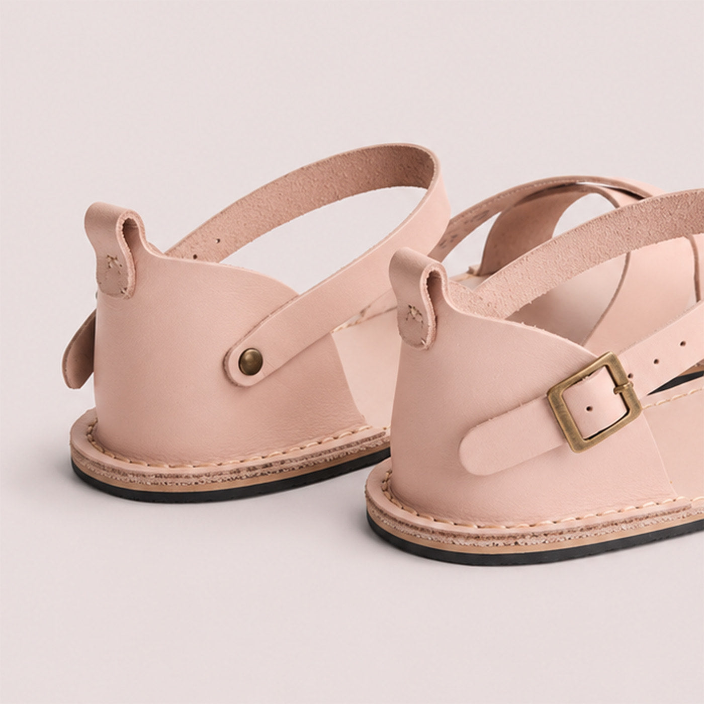 Crema | Flat leather sandals with ankle straps and debossed PLG three tree logo in soles