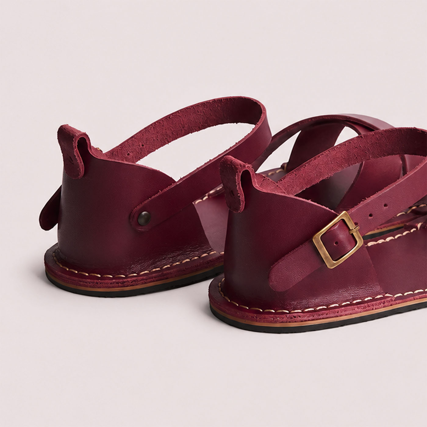 Marsala | Flat leather sandals with ankle straps and debossed PLG three tree logo in soles