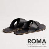 Nero | Flat leather sandals with debossed PLG three tree logo in sole, text reads "Roma. Inspired by the timeless charm of Rome, bring easy elegance to every step..."