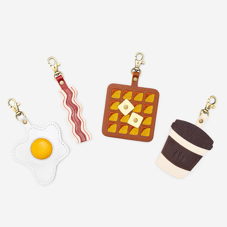 Pancetta | Keychain shaped like a strip of bacon with a swivel lobster clasp on a white background