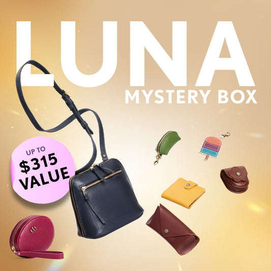 A Luna Crossbody and small goods. Text reads "Luna Mystery Box"
