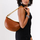 All Variants | Model carrying large Koala Sling Bag in Sienna