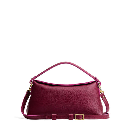 Orchid | Leather bowler bag with magnetic closure against a white background