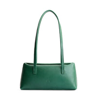 Bacalar | Leather bowler bag with magnetic closure against a white background