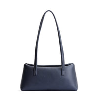Night Owl | Leather bowler bag with magnetic closure against a white background