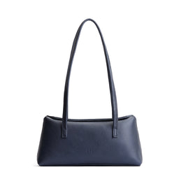Night Owl | Leather bowler bag with magnetic closure against a white background