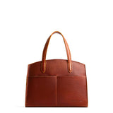 Nutmeg Medium | Leather tote bag with handles, adjustable crossbody strap, zipper top, and two back pockets