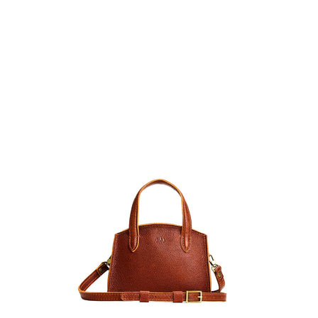 Nutmeg*Medium | Leather tote bag with handles, adjustable crossbody strap, zipper top, and two back pockets