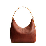 Nutmeg Large | U-shaped, flat-bottomed leather shoulder bag with adjustable strap
