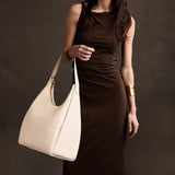 Pebbled Bone Oversized | U-shaped, flat-bottomed leather shoulder bag with adjustable strap