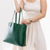 Bacalar Large | Model holding leather tote bag with interior snap key loop