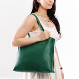 Bacalar Large | Model holding leather tote bag with interior snap key loop