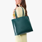 Sea Glass Large | Model carrying leather tote bag with matching leather handles
