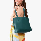 Sea Glass Medium | Model carrying leather tote bag with matching leather handles