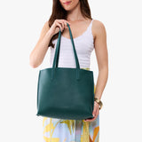 Sea Glass Medium | Model carrying leather tote bag with matching leather handles