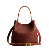 Nutmeg Small | Symmetrical bucket bag with handle, latch closure, and removable crossbody strap