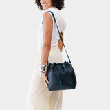 Boreal Large | Model wearing slouchy crossbody bag with drawstring closure