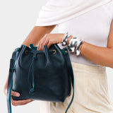 Boreal Large | Model holding slouchy crossbody bag with drawstring closure