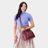 Orchid Large | Model wearing slouchy crossbody bag with drawstring closure
