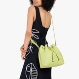 Shadow Lime Large | Model wearing slouchy crossbody bag with drawstring closure