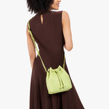 Shadow Lime Small | Model wearing slouchy crossbody bag with drawstring closure