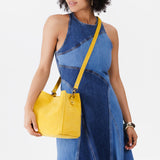Classic Mix Mystery Box | Model wearing Butterfly Bucket Bag as a crossbody