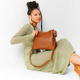  Honey | symmetrical bucket bag with latch closure and removable crossbody strap