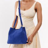Joni Blue | symmetrical bucket bag with latch closure and removable crossbody strap