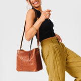  Meadow | symmetrical bucket bag with latch closure and removable crossbody strap