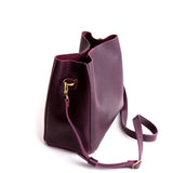 Plum | symmetrical bucket bag with latch closure and removable crossbody strap