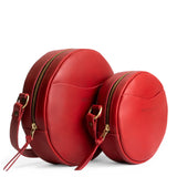 Ruby | Size comparison image of small and large circle shaped crossbody bags with top zipper