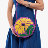 Wildflower Cattleya Large | Model holding circle shaped crossbody bag with top zipper