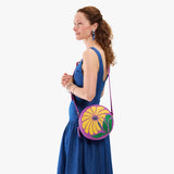 Wildflower Cattleya Large | Model wearing circle shaped crossbody bag with top zipper