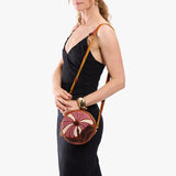 Wildflower Sienna Small | Model wearing circle shaped crossbody bag with top zipper