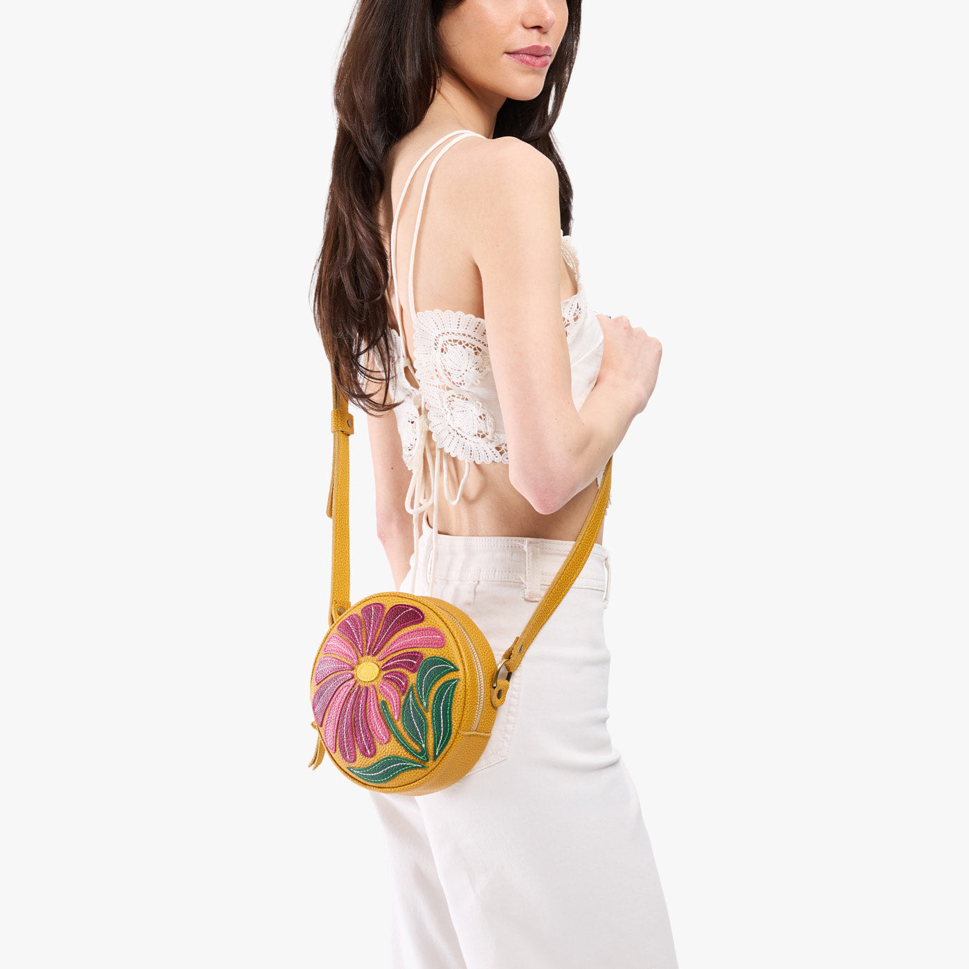 Wildflower Sunshine*Small | Model wearing circle shaped crossbody bag with top zipper