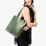 Metallic Greench Classic | Model holding medium Tote with dual shoulder straps and crossbody strap