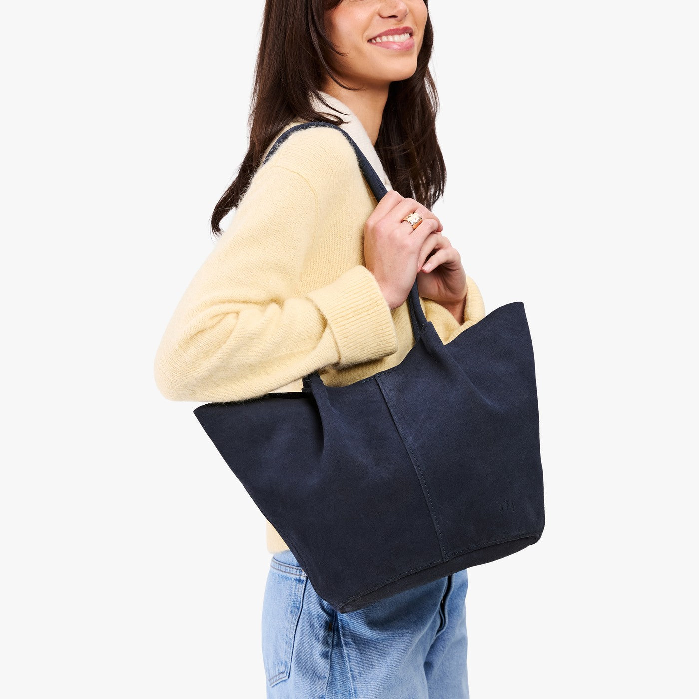 Alaska Blue*Large | Model holding wide bucket shaped tote bag with matching leather handles