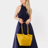 Hello Yellow Large | Model holding a  leather tote bag 