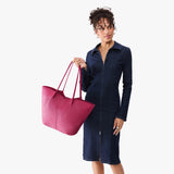 Cosmo Oversized | Model holding extra wide bucket shaped tote bag with matching leather handles