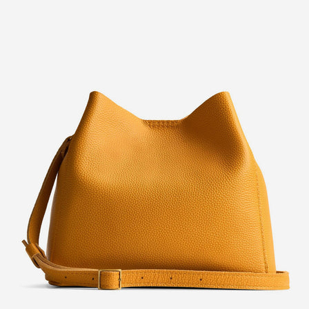 Royalty | Symmetrical bucket bag with latch closure and removable crossbody strap