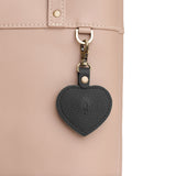 Pebbled--black | Heart-shaped airtag holder keychain with a swivel lobster clasp on bag