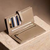 Satine Large | Leather bifold wallet with a strap and bar closure