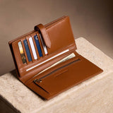 Vintage Tan Large | Leather bifold wallet with a strap and bar closure