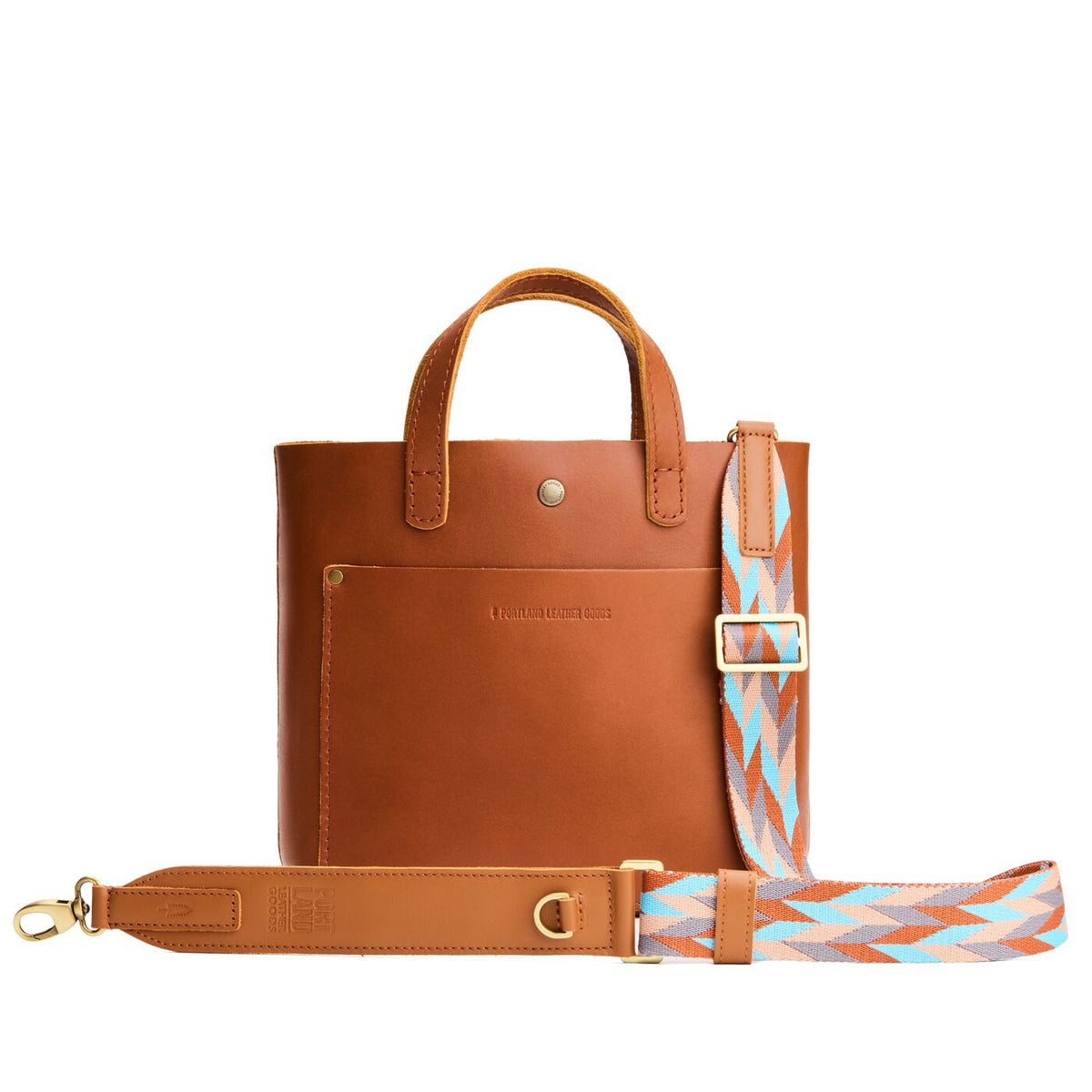 Driftwood | Patterned fabric and leather strap on a white background