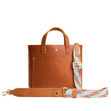 Driftwood | Patterned fabric and leather strap on a white background