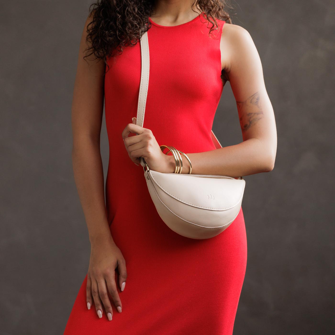 Bone*Small | Model wearing petite half circle shaped sling bag