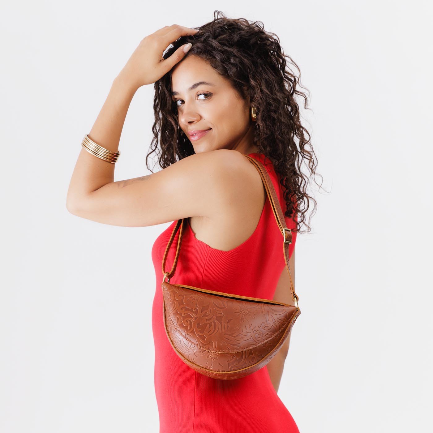 Meadow*Small | Model wearing small half-moon sling bag on shoulder