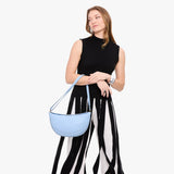 Skyway Large | Model wearing half circle shaped sling bag