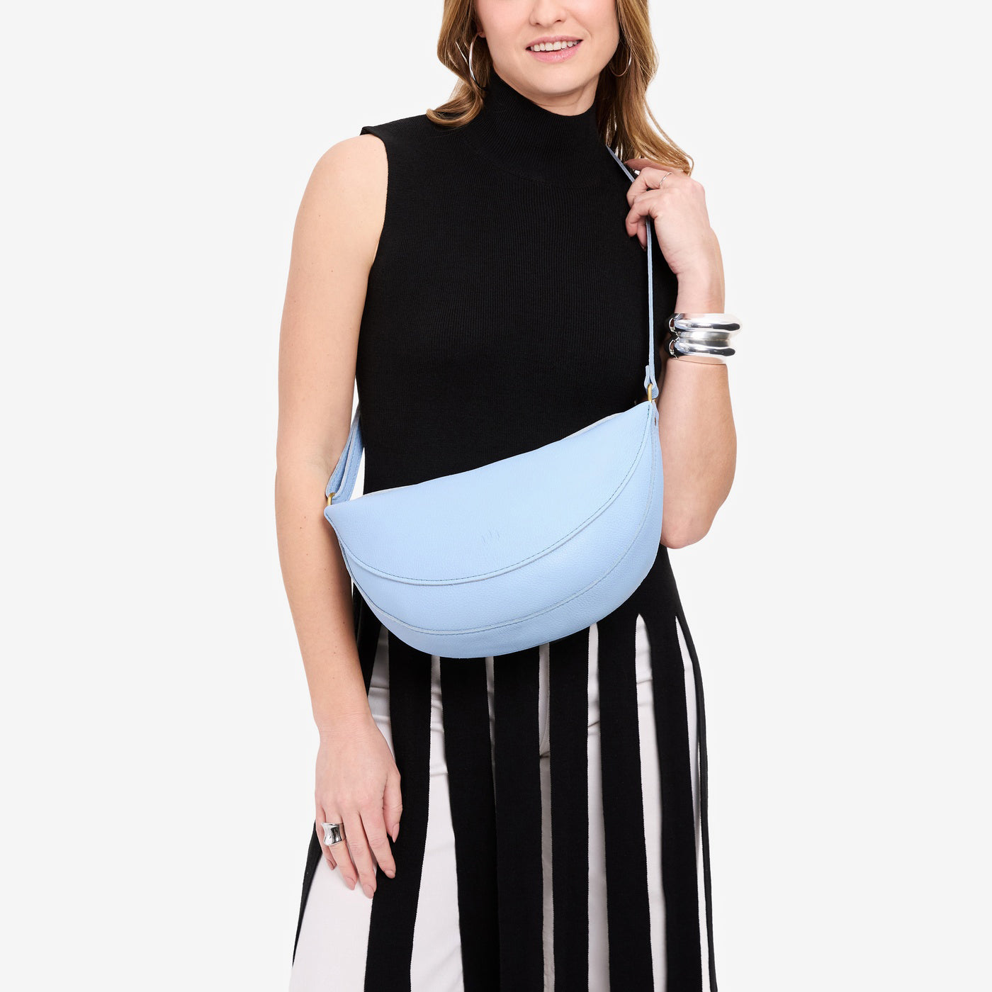 Skyway*Large | Model wearing half circle shaped sling bag